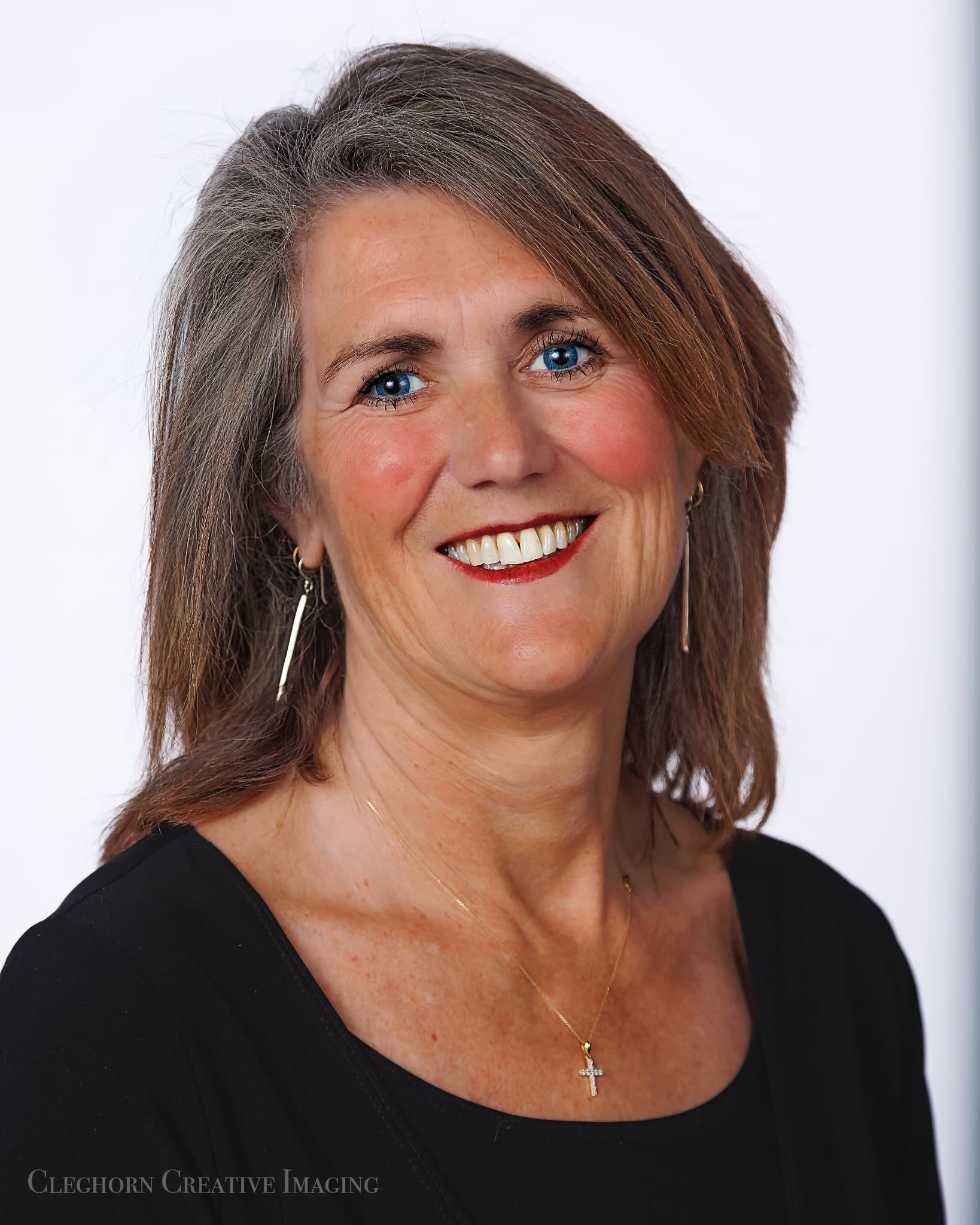 Joanne, founder of FHJ Properties, smiling in a professional portrait